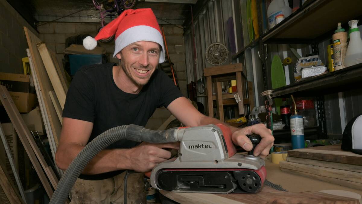 SANTA'S WORKSHOP: Factorem carpenter Daniel Croxton has been going flat out making his handcrafted presents in the lead-up to the Christmas markets. Picture: Kenji Sato 
