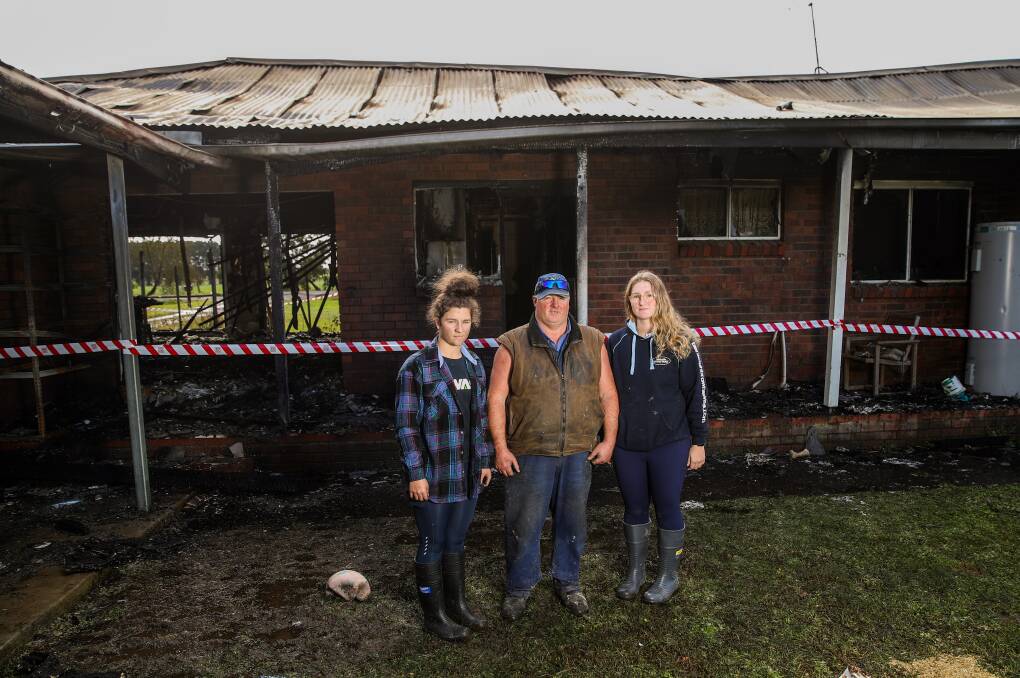 LUCKY: Leah Dickson, 16, Bryan Dickson and Jacque Dickson, 19, survey the damage to their home after Monday's fire. Picture: Morgan Hancock