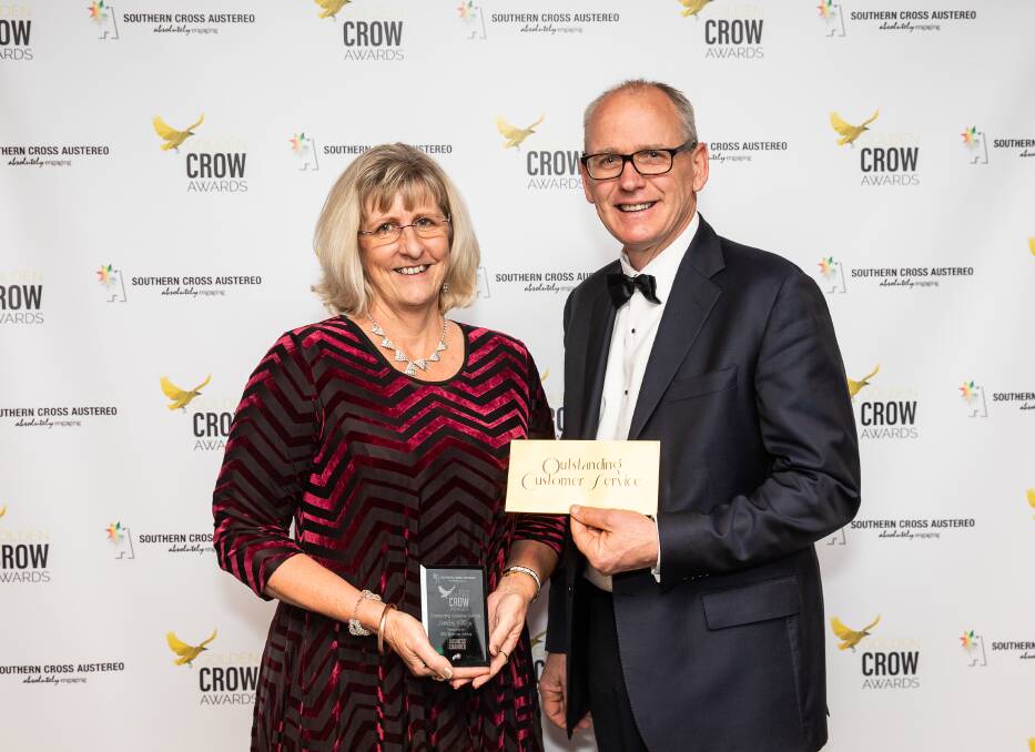 Dedication awarded: Settlers Village team members Amanda Maniscalco accepting the Golden Crow Award from John Elgin from BEC Business Advice.