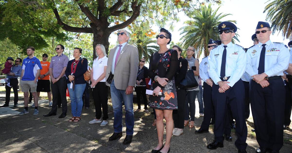 OUT IN NUMBERS: Wagga police officers join Wagga residents in the name of White Ribbon day at the Wagga Women’s Health Centre. 