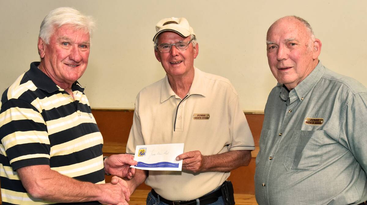 WELCOME BOOST: John McLaren and Bryan McMullen from the Junee Men's Shed receiving the Warren Helping Hand donation from Ray Warren. Picture: Supplied.
