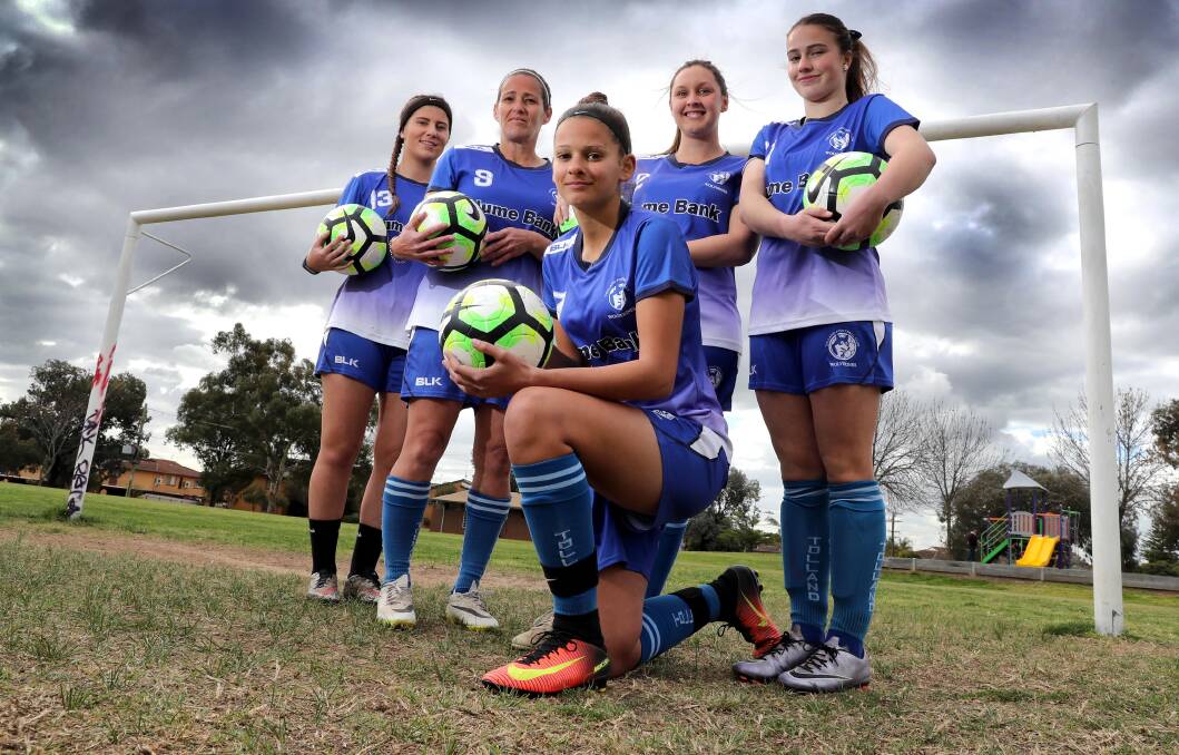 PREMIERSHIP FAVOURITES: Tolland's Christina Grauer-Kompos (front) gearing up for the Leonard Cup grand final with teammates Lizzie Read, Monica Kompos, Jessica Leak and Neva Walker at Kessler Park. Picture: Les Smith