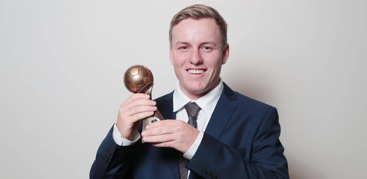 HONOURED: Young captain Duncan Cameron with his Pascoe Cup Player of the Year trophy at the Football Wagga Gala Night on Friday. Picture: Kieren L Tilly 