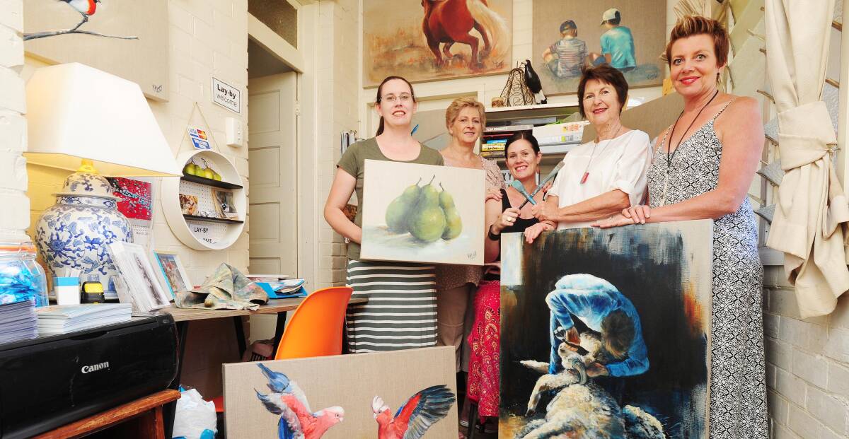 ARTISTIC FLAIR: Local artists Suzy Houghton, Carol Stewart, Kylie Van Tol, Bev Harris and Sue Dyde gearing up for the weekend's Wagga Art Trail. Picture: Kieren L. Tilly 
