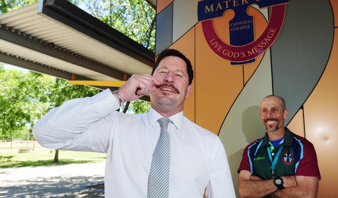 DRUMMING UP SUPPORT: Mater Dei assistant principal Daryl Lawrence and science teacher Stephen Wheeler. Picture: Kieren L. Tilly