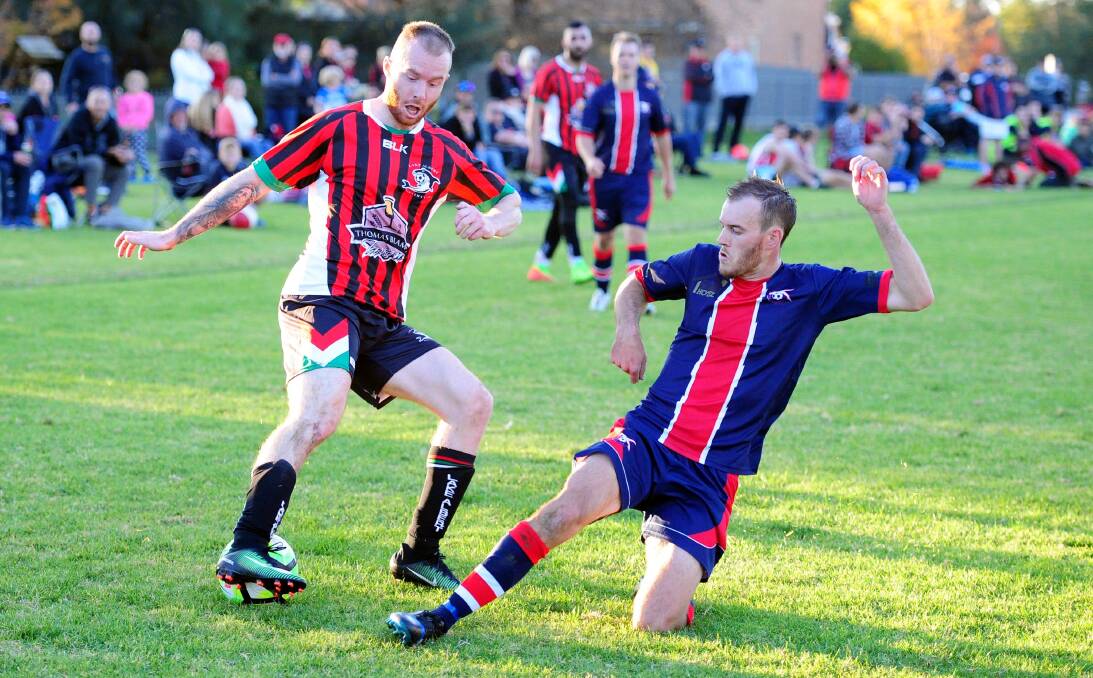 ON THE BALL: Lake Albert's Jamie Rankin protects the ball from Henwood Park's Ben Bedwell during their teams' 0-0 draw round seven at Rawlings Park. Picture: Kieren L Tilly