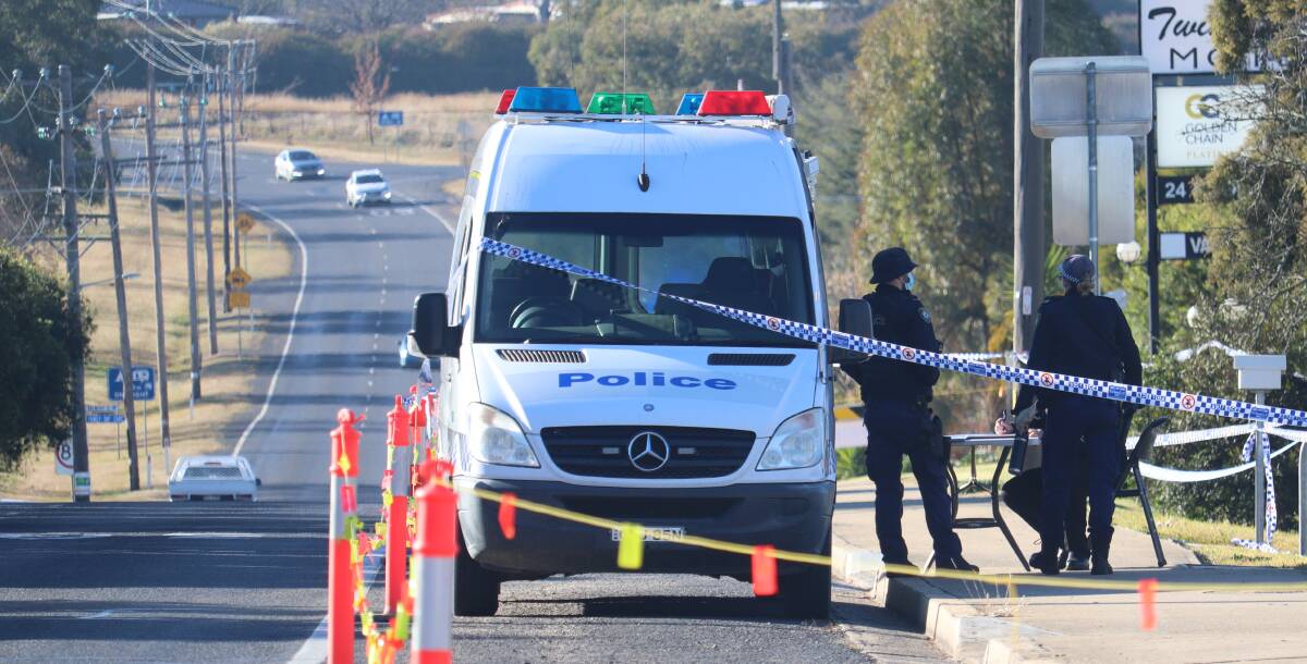 Double stabbing: New England police scour the Glen Innes Road crime scene in Inverell on Wednesday morning. Photos: Jacinta Dickins