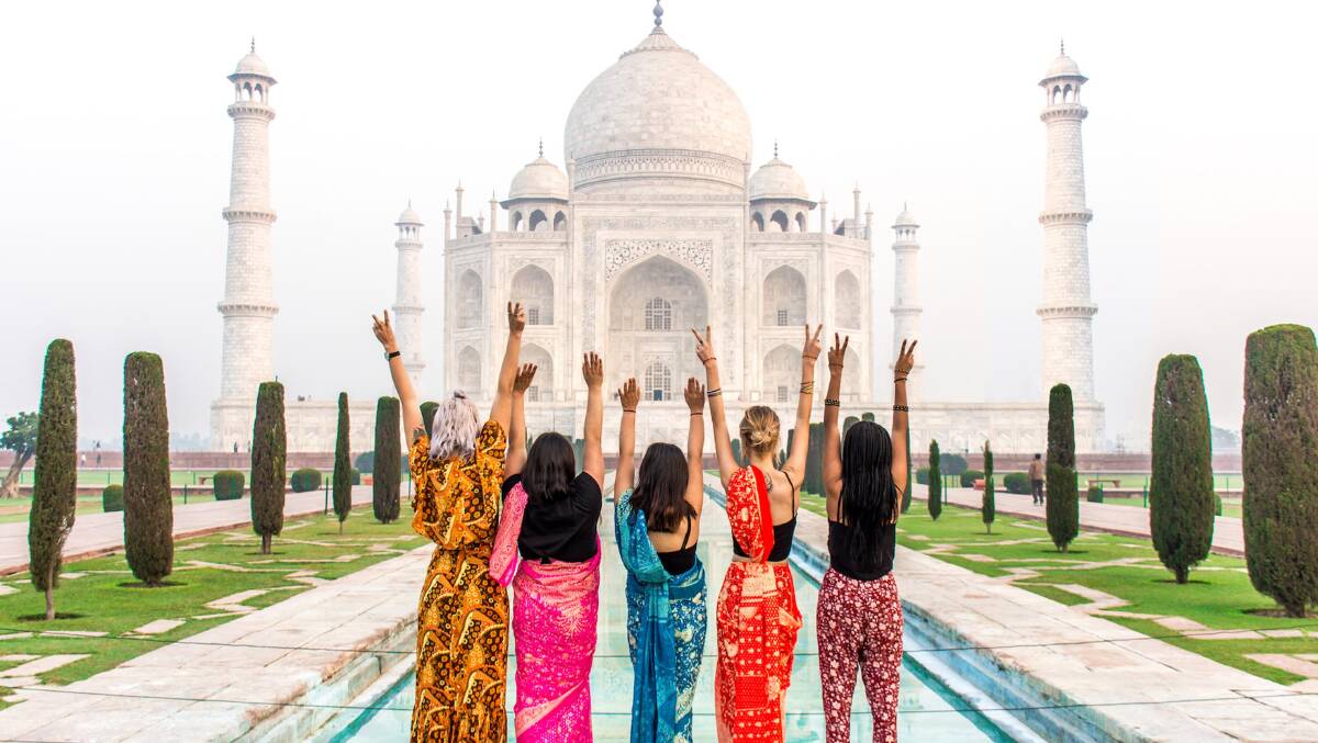 Standing their ground in from of the Taj Mahal … a group of millennials.