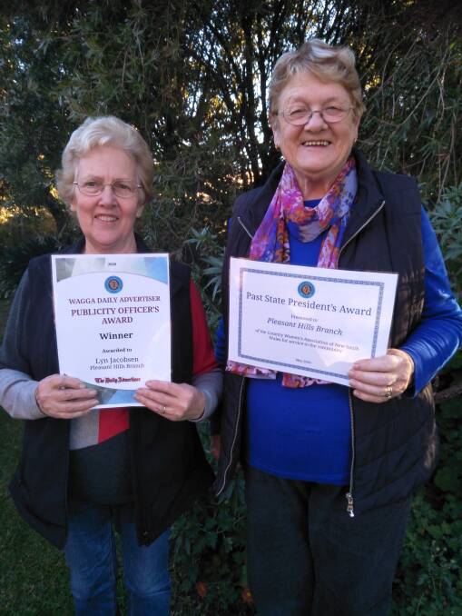 COMMUNITY SPIRIT: Pleasant Hills CWA's Lyn Jacobsen and Bev Frohling with their award certificates. Picture: Supplied