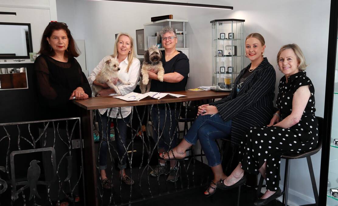 UNITED FRONT: The Shop Fitzmaurice group: Louise Leahy, Fiona Beggs with Pablo, Roley McIntyre with Murphy, Belle Armstrong and Louise Golden. Picture: Les Smith