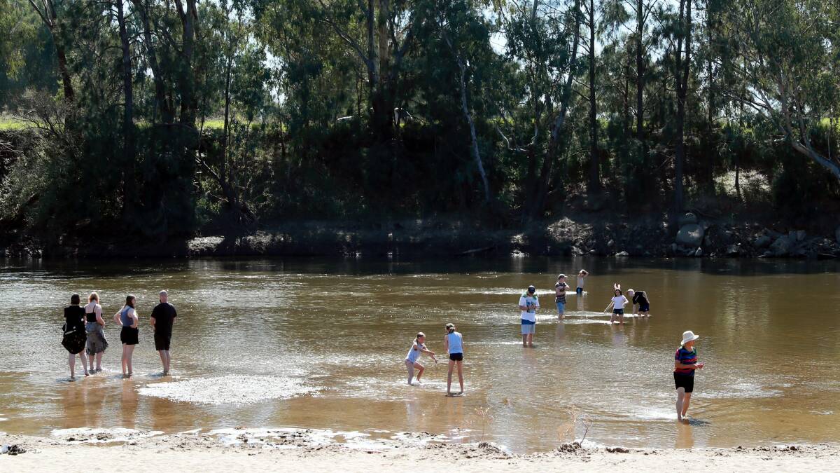 CALL FOR ACTION: Visitors enjoy a trip to Wagga Beach, a popular yet potentially risky swimming spot. Picture: Emma Hillier
