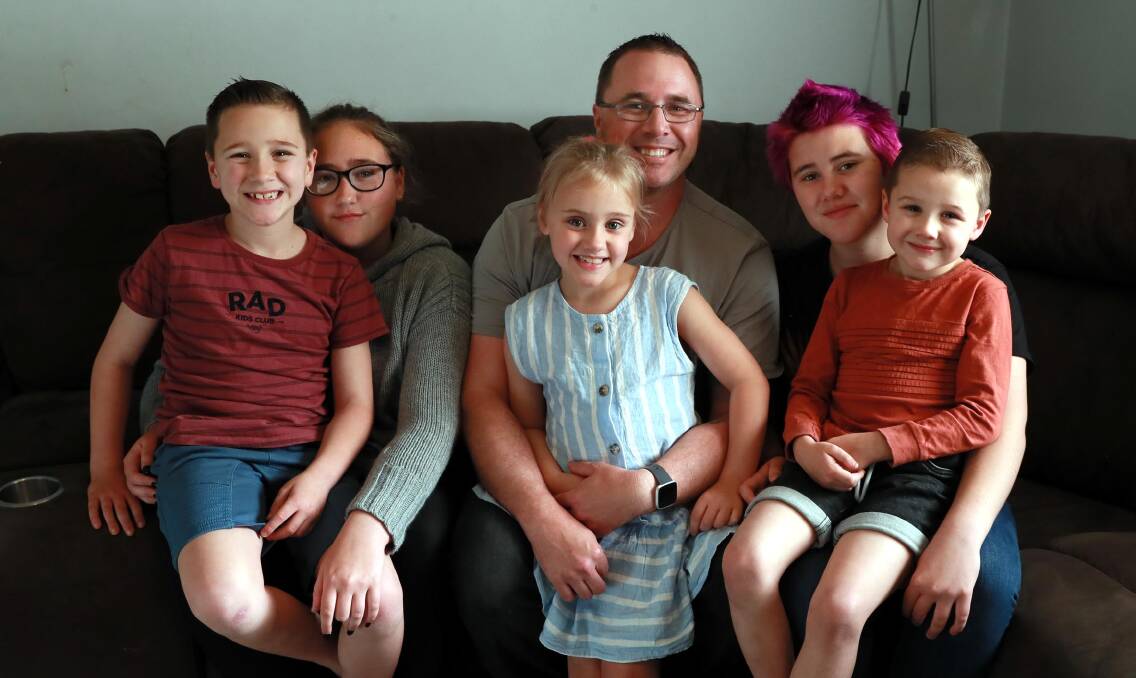 CLOSE-KNIT: Aidan Vivian with five of his now seven children: Brock, 8, Ashleigh-Maree, 14, Maddison, 7, Tailah 12 and Andrew, 5. Picture: Les Smith
