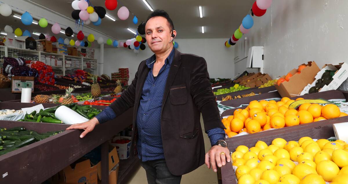 OPEN FOR BUSINESS: Hasan Balaseeni in the fresh produce section of his grocery store on Ashmont's Tarakan Avenue. Picture: Emma Hillier