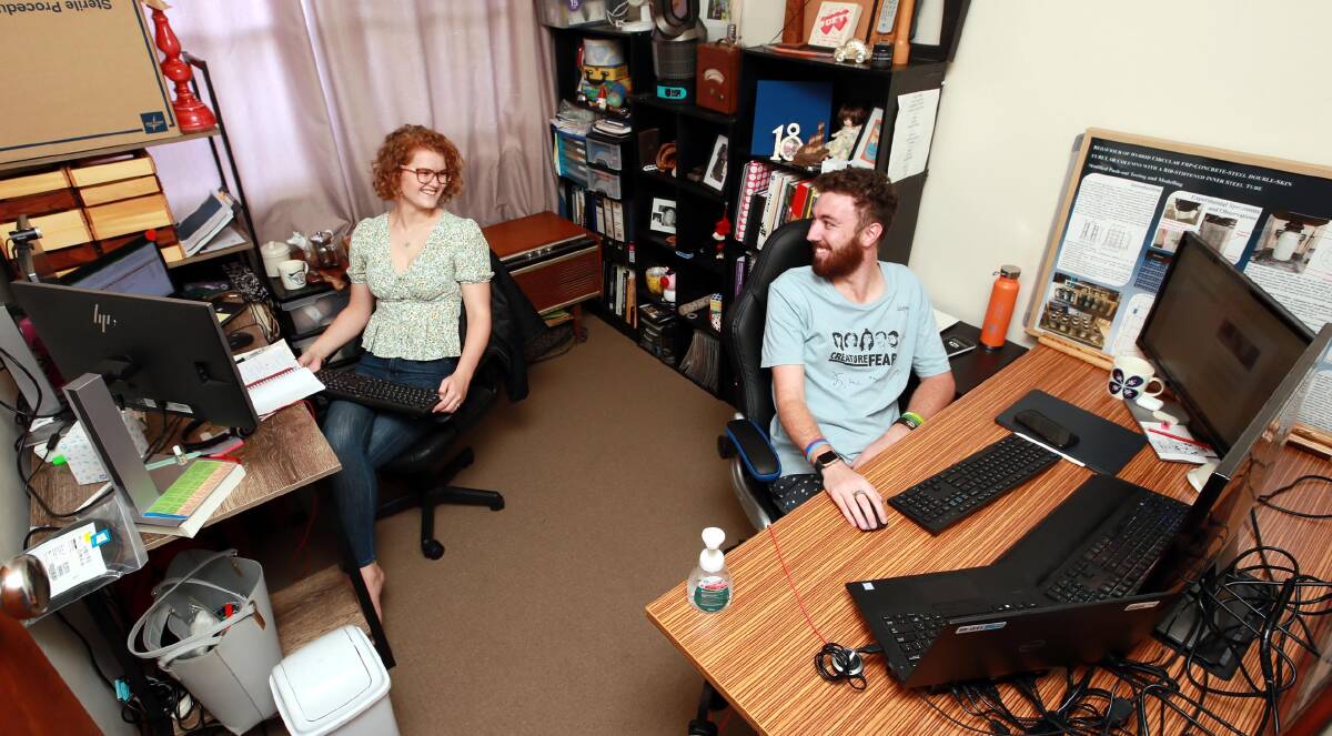 SET UP: Hannah Smith and her fiance, George, are adjusting to life working from home in the same room. Picture: Les Smith