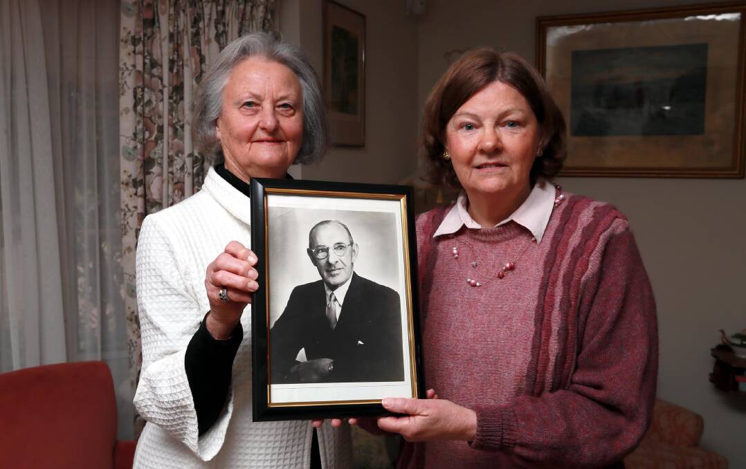 FAMILY HISTORY: Wagga's Margaret Cerabona and Annette Forsyth, pictured here with a photo of Mrs Forsyth's grandfather - the highly regarded ophthalmologist Sir Norman Gregg. Picture: Les Smith