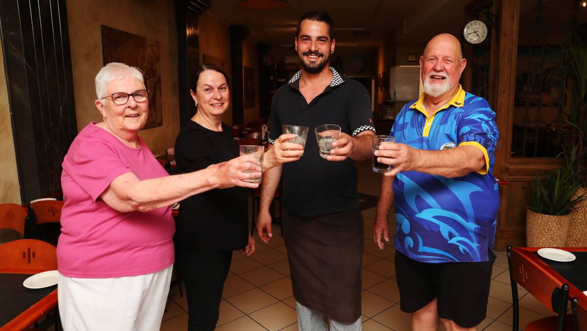 CHEERS: Mary Smith, Carmen Gioia, Nick Gioia and Les Smith raise a glass to Il Corso. Pictures: Emma Hillier