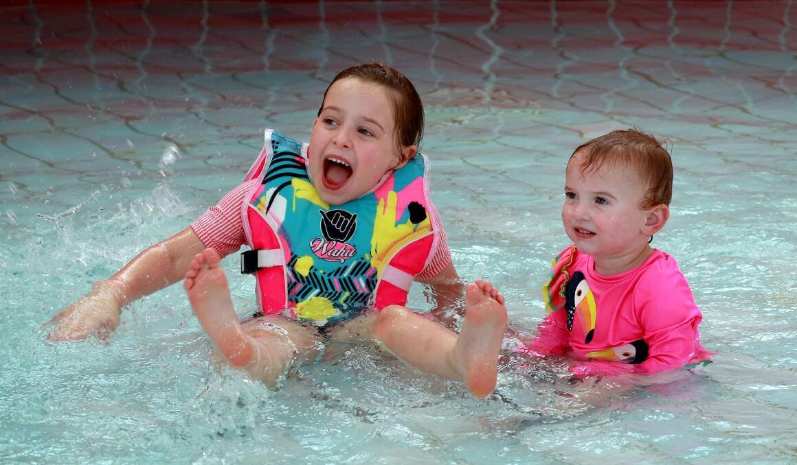 BEAT THE HEAT: Wagga's Amity Hayward, 5, and her sister Edie, 12 months on Saturday. Picture: Les Smith