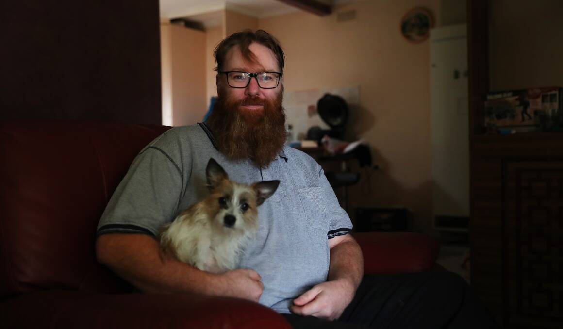 MANY CHANGES: Wagga's Kris Redden, who has autism spectrum disorder, and his dog Tilly are adjusting to life in lockdown. Picture: Emma Hillier