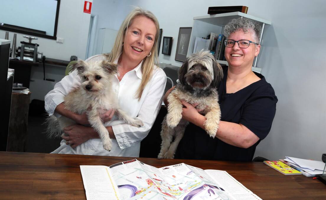 PROJECT: Monty and Moo's Fiona Beggs and Sculpted Jewels' Roley McIntyre with their new walking map of the precinct. Picture: Les Smith