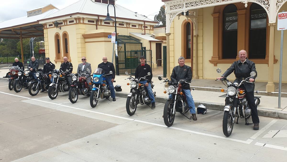 READY TO GO: The riders stop for a break and a photo at Wagga's train station during their Gentleman's Ride. Picture: Supplied