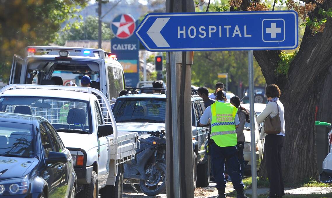 SAFETY FIX: Emergency services attend the scene of a crash on Edward Street, where two intersections have been identified for upgrades under a government funding program. 