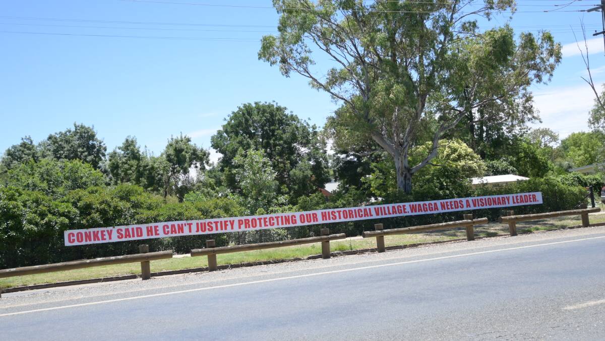 PROTEST: One of the protest signs erected in North Wagga that calls for better flood protection. Picture: Kenji Sato
