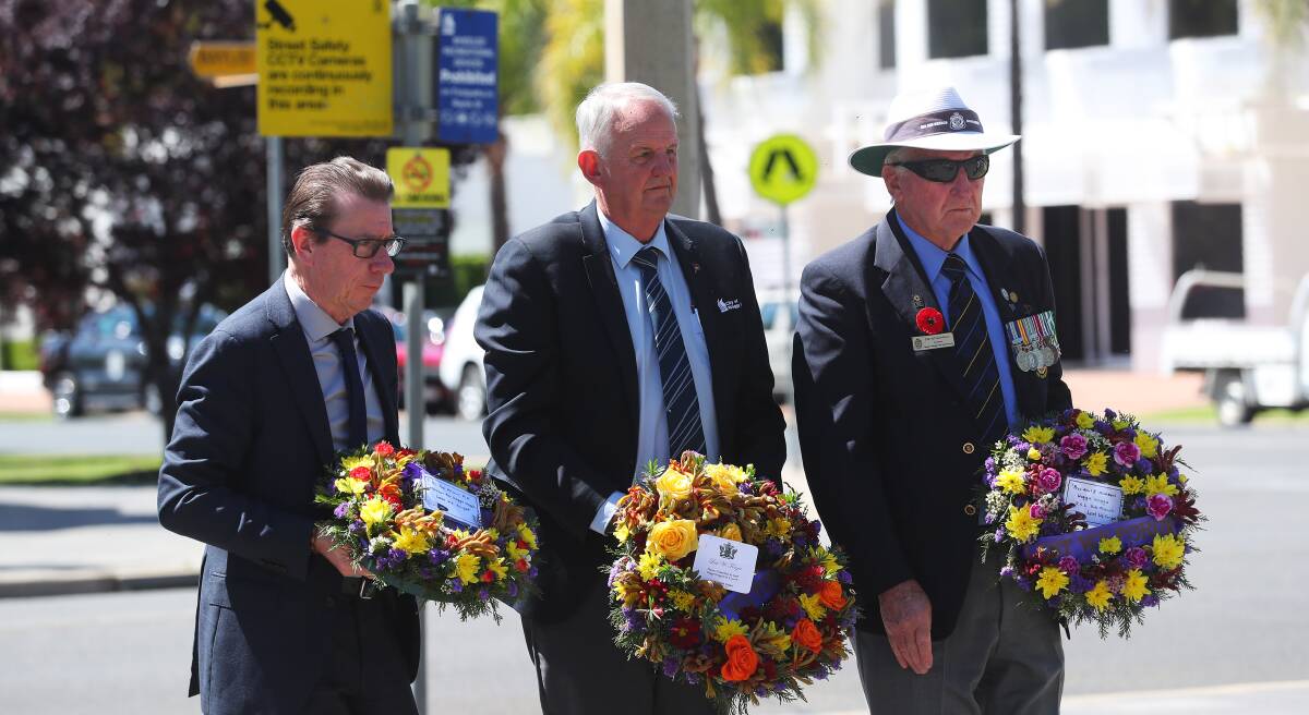 WELCOME RETURN: Wagga MP Joe McGirr, mayor Greg Conkey and RSL sub-branch president David Gardiner at last year's scaled-back Anzac Day. Picture: Emma Hillier
