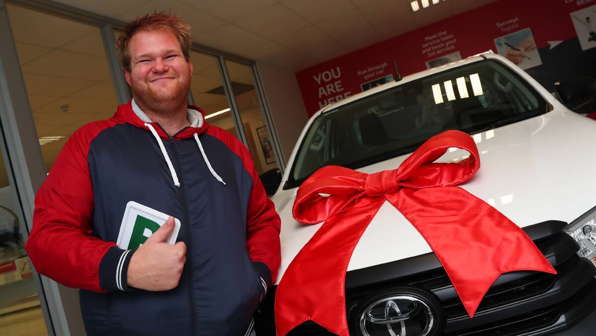 ALL SMILES: Michael Bale, 23, is the first person in Kurrajong's history to buy his own car while living in a group home. Picture: Emma Hillier