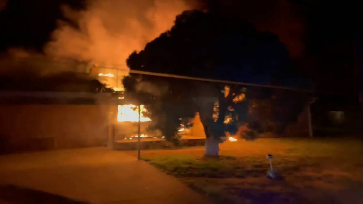 IN FLAMES: The house was already well alight when Turvey Park Fire Crews were called to the scene on Fernleigh Road. Video: Fire and Rescue NSW