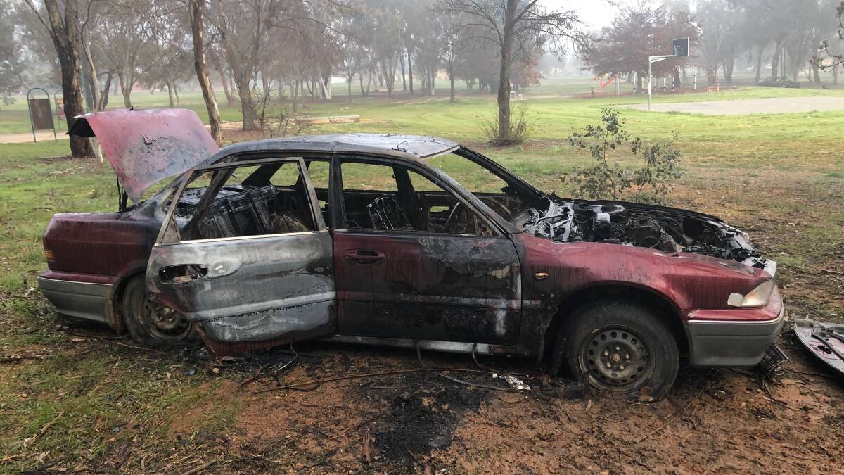 DESTROYED: This car was set alight in the reserve along Blakemore Avenue in Ashmont. Picture: Catie McLeod