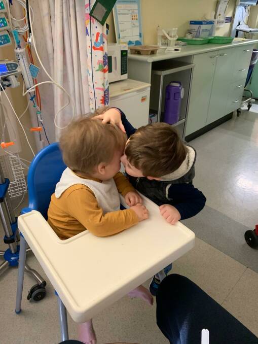 Darcy Carey gives his little brother a kiss. Picture: Supplied