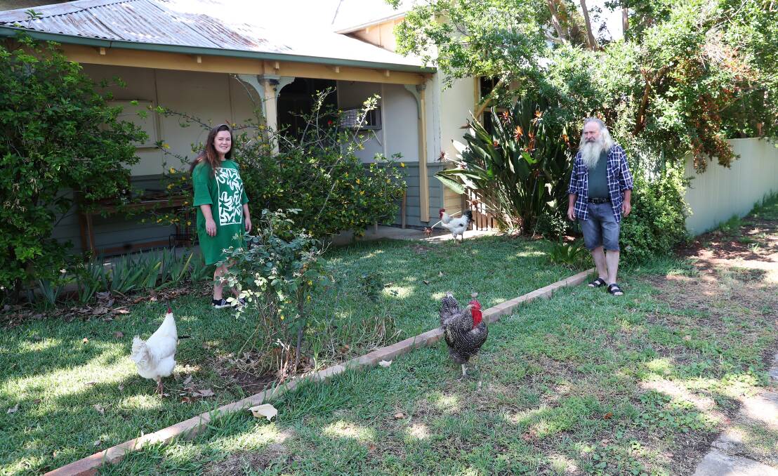 Ruth and Shane Cummins with the three roosters. Picture: Emma Hillier