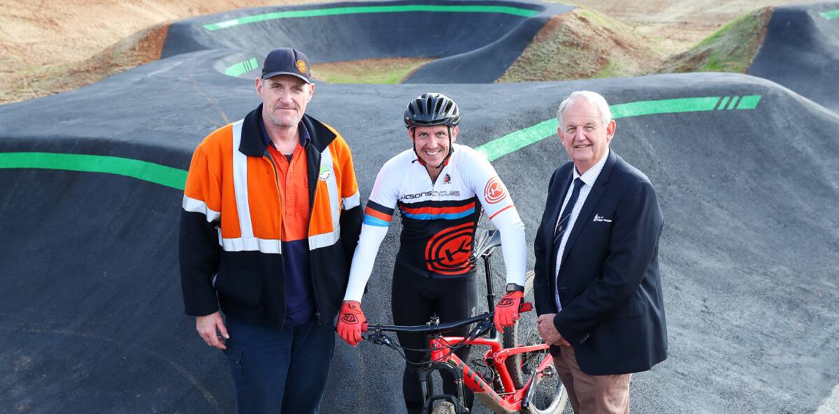 GOOD NEWS: MTB Wagga club president David Reid, with cyclist Brendan Owers and and Wagga mayor Greg Conkey. Picture: emma Hillier