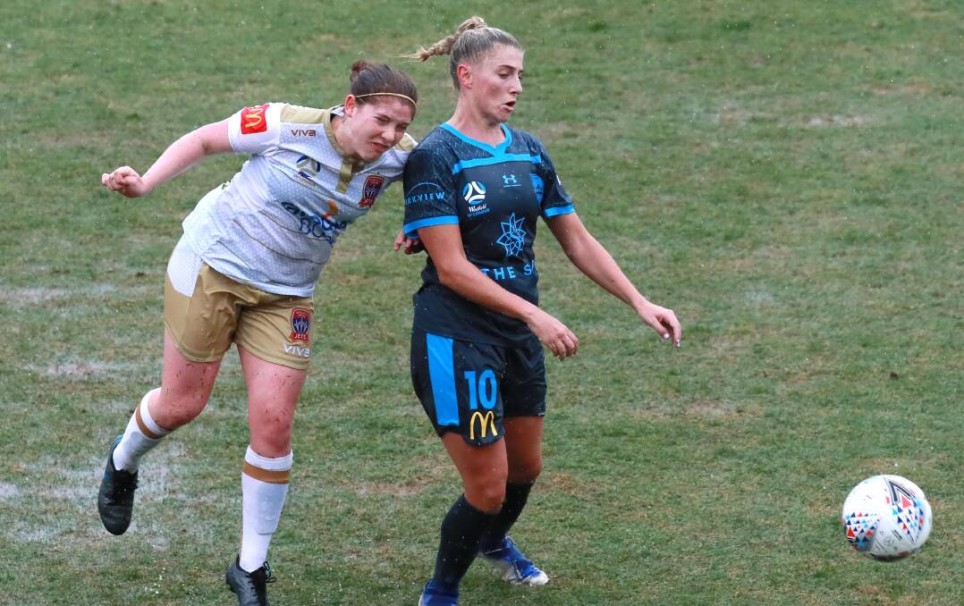 RETURN: Sydney FC's Remy Siemsen and Newcastle's Annabel Martin do battle during the A-League Women's trial at Wagga in 2019. Picture: Les Smith