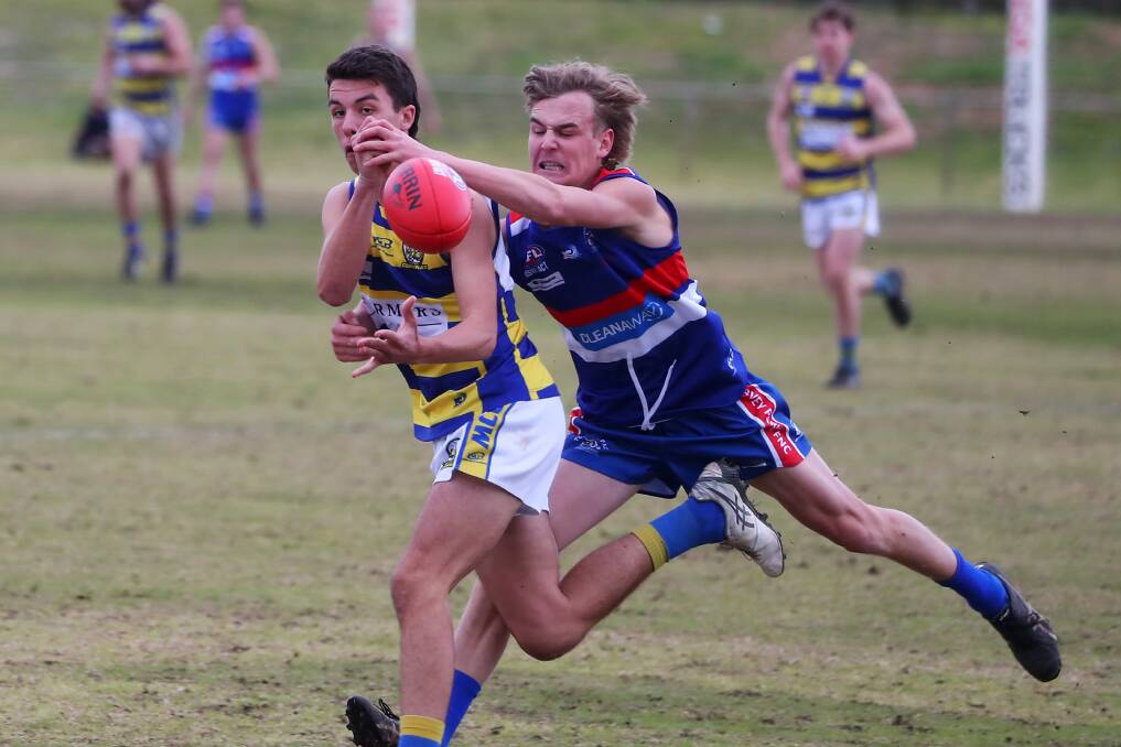 HEAT IS ON: Turvey Park's Tate Isaac tackles MCUE's Flynn Collins during the Bulldogs' strong win on Saturday. Picture: Emma Hillier
