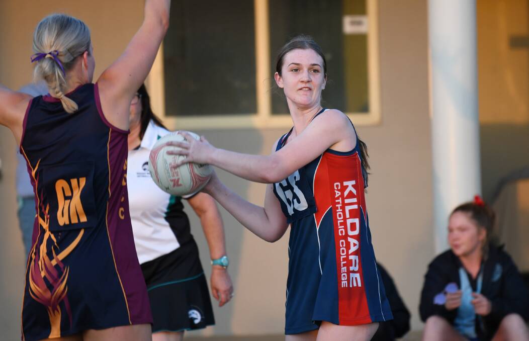 BIG WIN: Kildare Catholic College's Brooke Harpley looks to pass during Tuesday's Tracey Gunson Shield grand final rematch win over Mater Dei Catholic College.