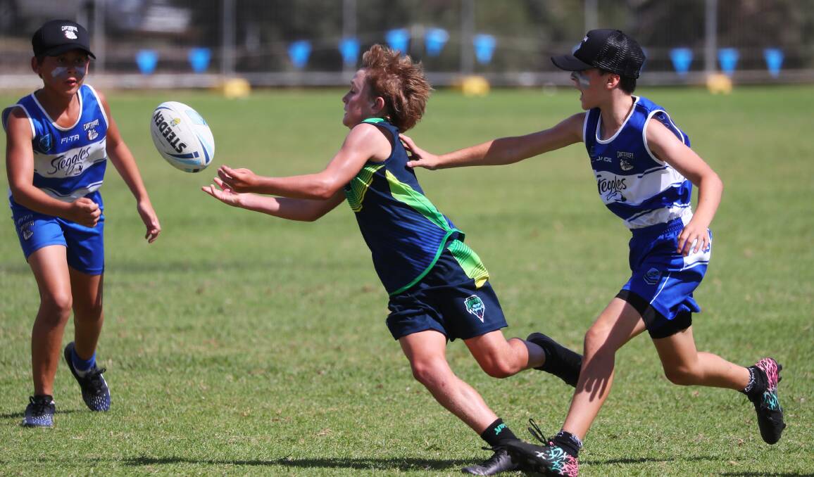 BACK ON: Wagga's William Smith gets a pass away against Canterbury in an under-12s clash last year. 