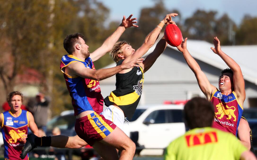 NAIL BITER: Ganmain-Grong Grong-Maton'gs Daniel Foley and Wagga Tiger Zachery Brain contest a mark at Ganmain Sportsground on Saturday. Picture: Emma Hillier