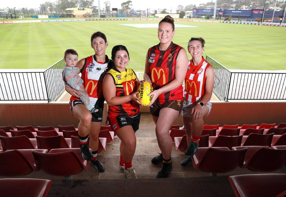 Sarah Harmer (North Wagga, pictured with baby Parker), Kyra Jackson (Riverina Lions), Hannah Finemore (East Wagga Kooringal) and Gabrielle Goldsworthy (CSU) will play in AFLW curtain raisers at Robertson Oval on Saturday. Picture: Les Smith
