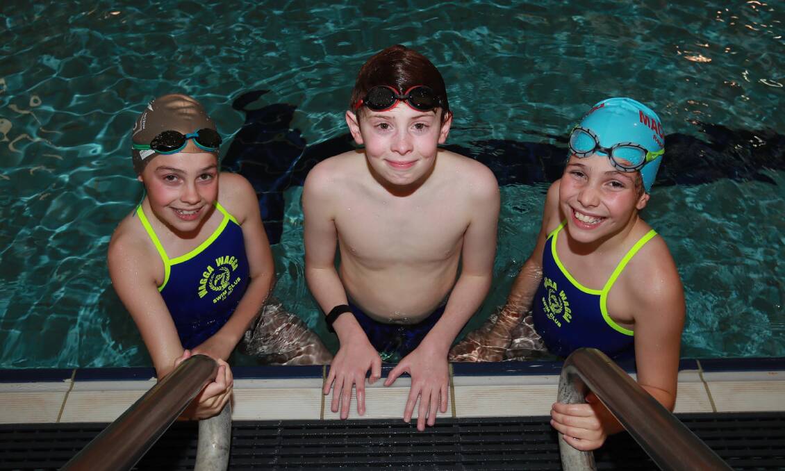 MAKING A SPLASH: Neve Scholz, 12, Sebastian Farrow, 12 and Alana Scholz, 10 at training at Oasis Aquatic Centre last week. Picture: Les Smith