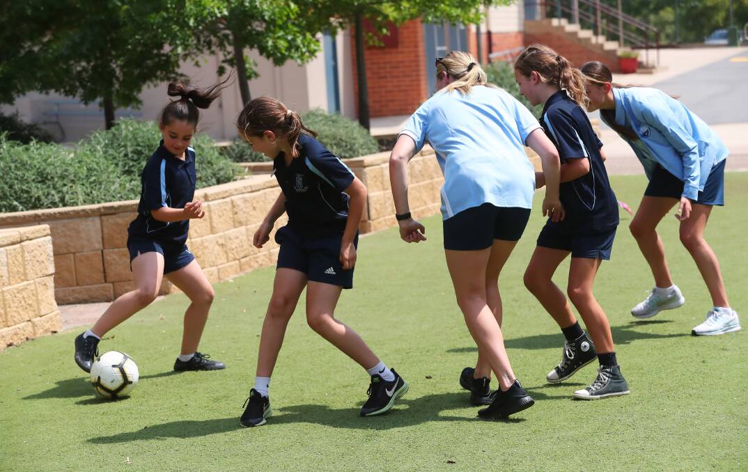 Wagga Public School students get put through their paces by Sydney FC's Jessika Nash and Ally Green on Friday. 