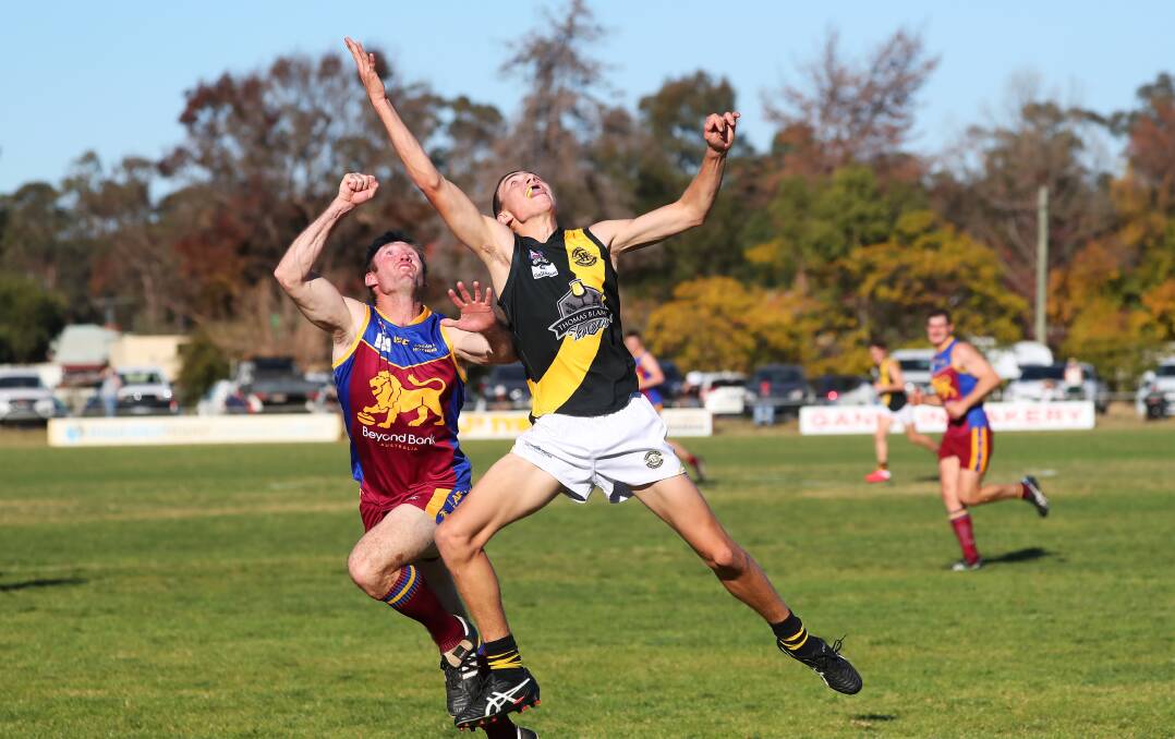 PIVOTAL: GGGM's Luke Walsh (left) looks to make a spoil against Wagga Tigers earlier this season. Picture: Emma Hillier