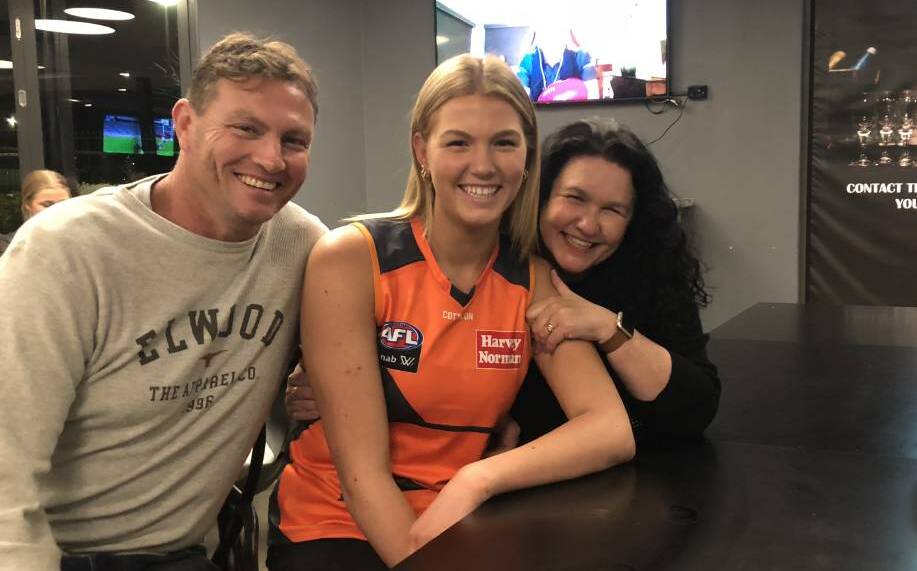 BIG TIME: Morphett with parents Paul and Rebecca after she was picked up by the Giants in last year's AFL Draft. Picture: Matt Malone