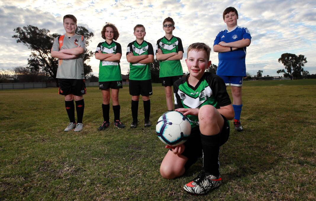WE'RE BACK: Junior soccer players (back, from left) Henry Gunter (Wagga United, 13) with South Wagga Warriors players William Cooper, 12, Lachlan Miles, 11, Walter Schoonmaker, 11, Tolland player Oliver Hollis, 10 and South Wagga's Will Higginson, 11.