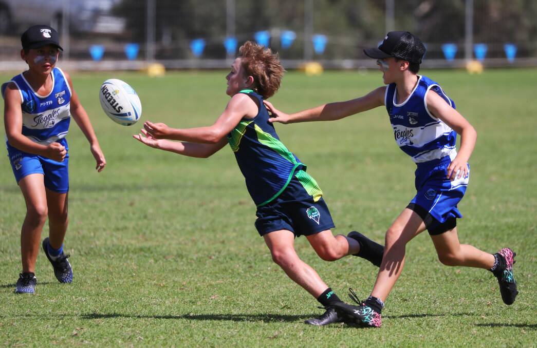 FINE FORM: Wagga under-12s player William Smith offloads a pass during Saturday's Junior State Cup Southern Conference clash with Canterbury at Jubilee Park. Picture: Emma Hillier