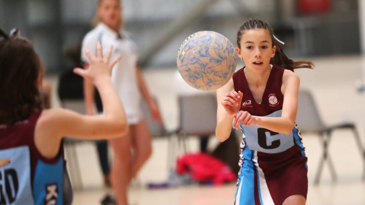 Grace Cooper in action during an under-12 netball grand final last year. Picture: Emma Hillier