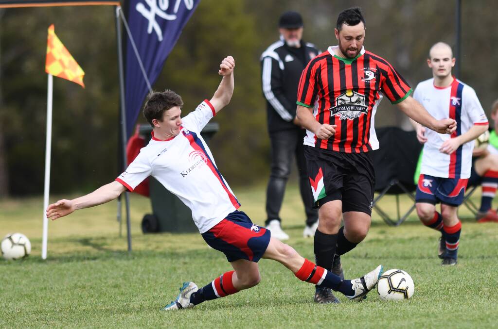 REGO ISSUE: Henwood Park's Chris Hart looks to tackle Lake Albert's Kane Baumer during last year's preliminary final. 