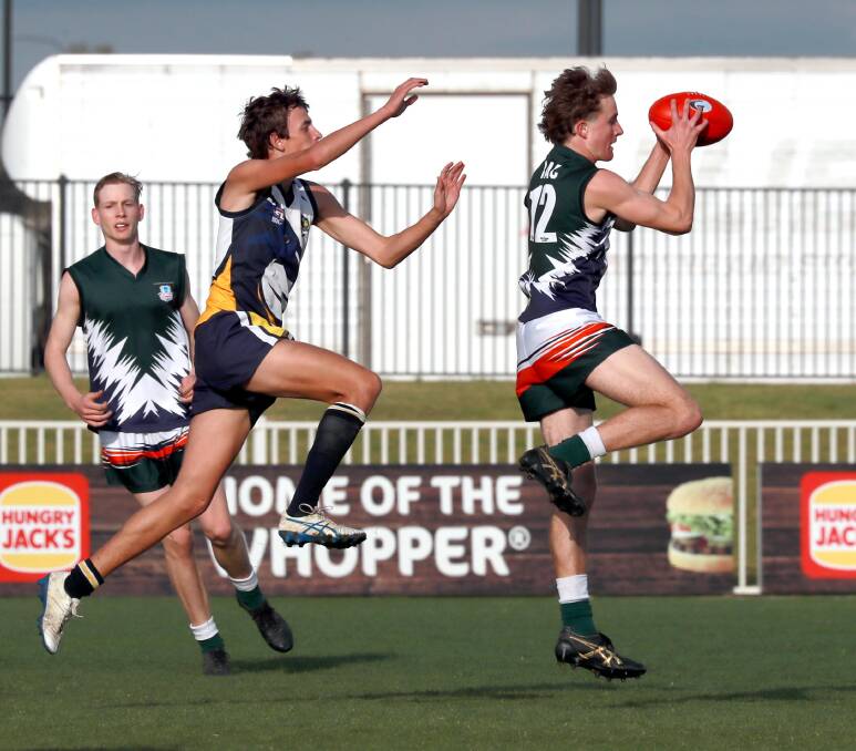 RESCHEDULED: The Riverina Anglican College's Luke Fellows and Kildare's Hugh Schmetzer do battle in Wednesday's Carroll Cup semis. Picture: Les Smith