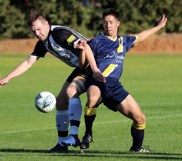 ROAD BLUES: Jake Ploenges (left, pictured playing against Southern Tablelands) and the Wagga City Wanderers returned home empty-handed again this week. 