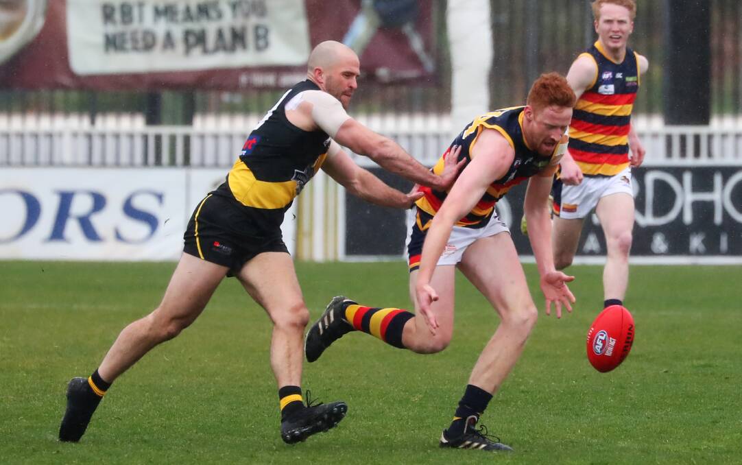 MOBILE BIG: Leeton-Whitton ruckman Mason Dryburgh battles with Wagga Tiger Shaun Campbell. Picture: Emma Hillier